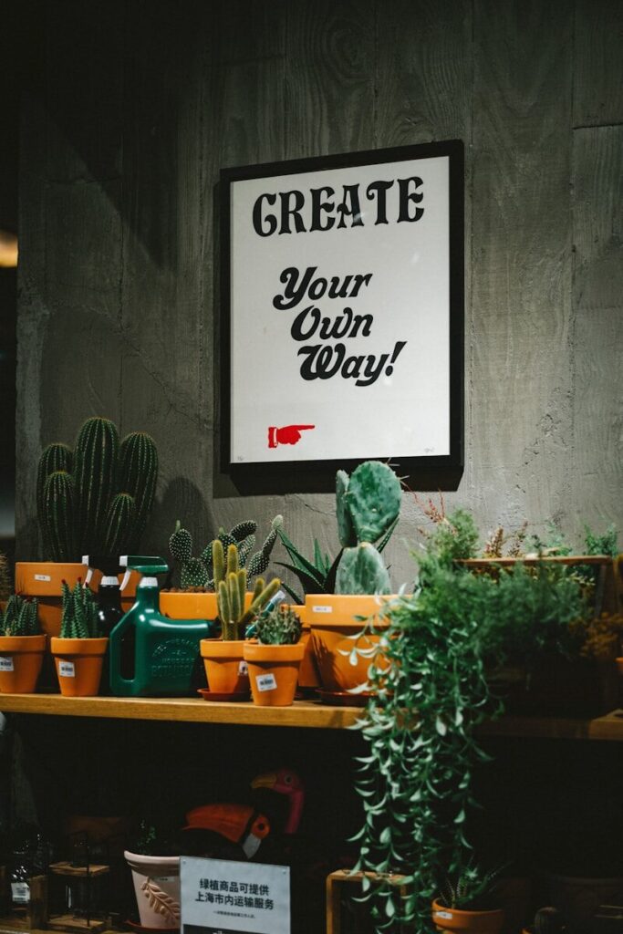 a sign that says create your own way on a wall